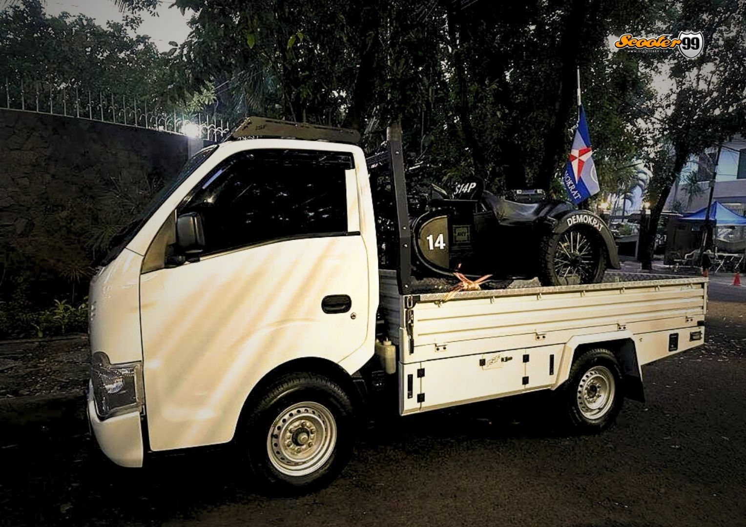 Towing truck in action, securing a vehicle on the roadside